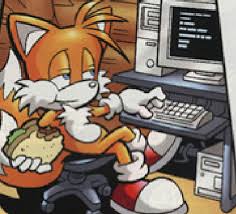 tails-confident-eating-behind-computer.jpg